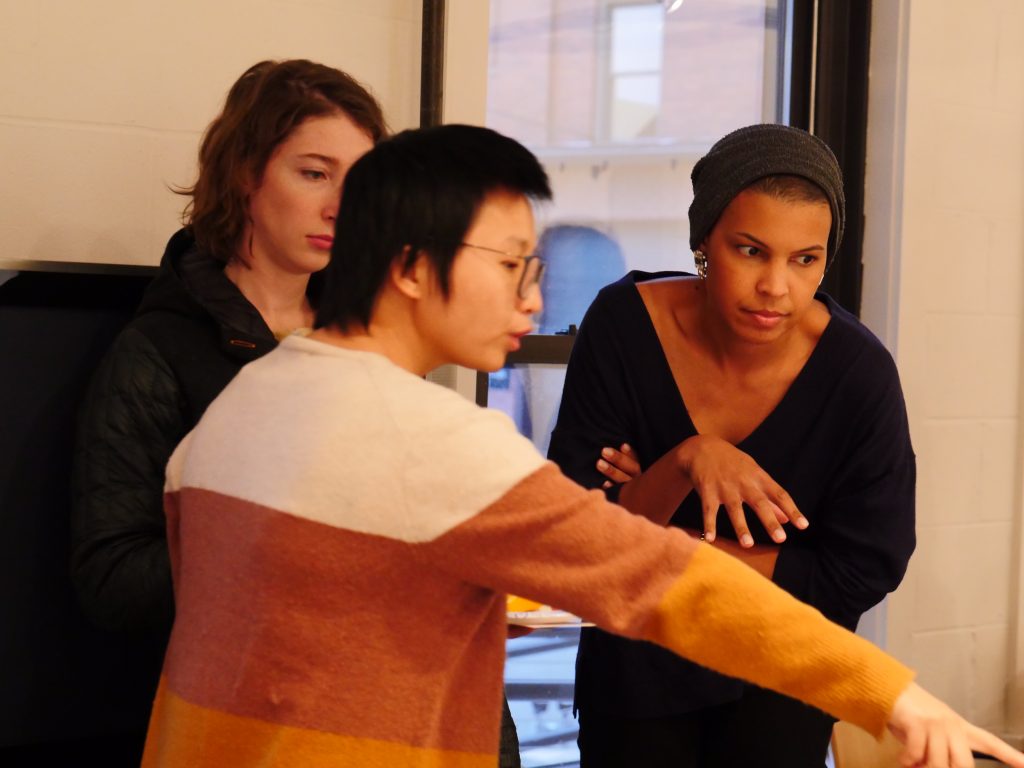 kate speaks with two gallery visitors